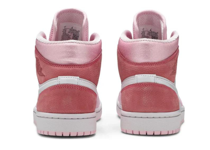 Rear view of the Jordan 1 Mid 'Digital Pink' highlighting the padded collar, embossed Air Jordan Wings logo, and premium suede and leather construction.