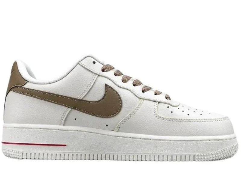 Side view of Air Force 1 Low 'Mini Swoosh Milk Coffee' sneaker in white leather with brown Swoosh and red mini Swoosh. Classic design with premium materials.