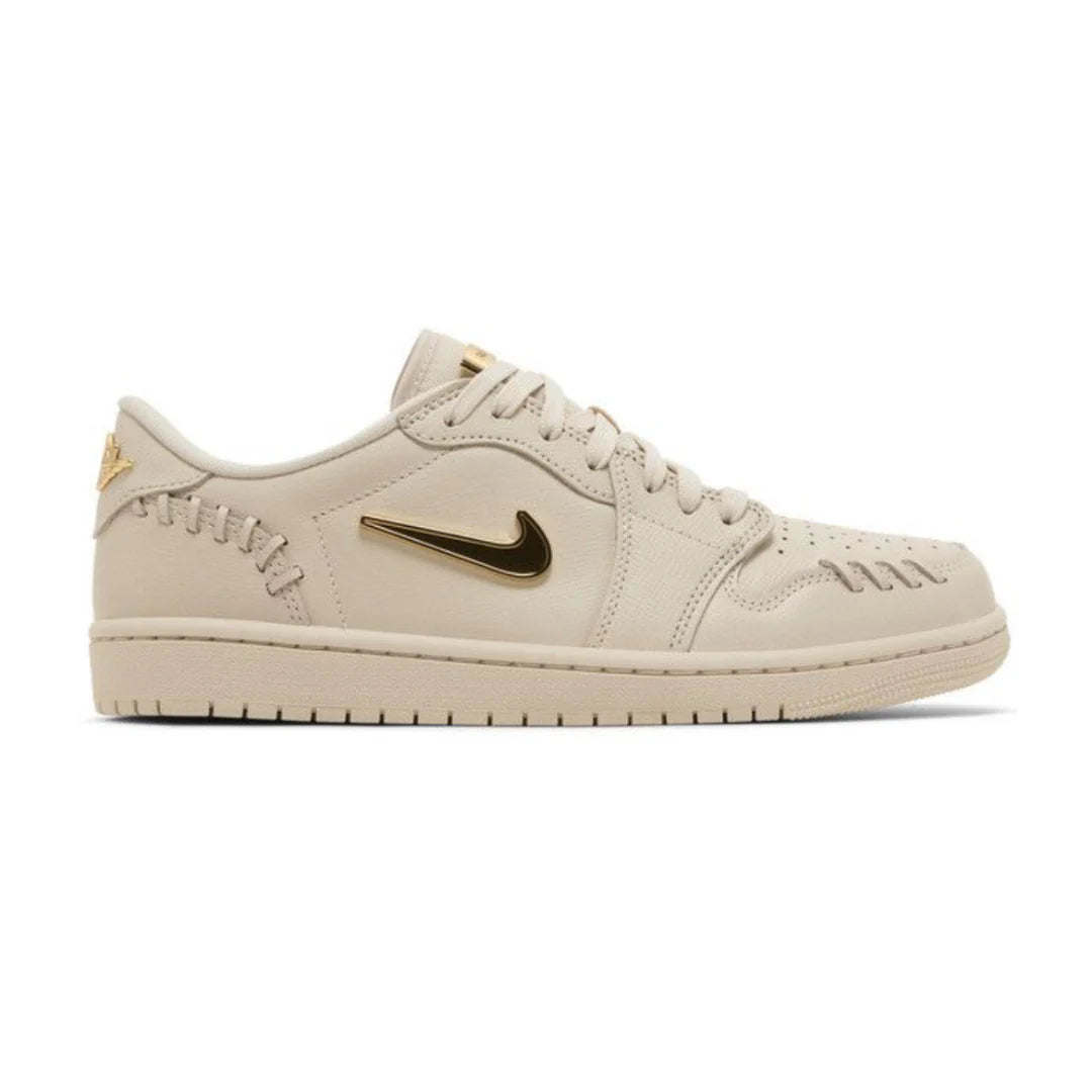Jordan 1 Low - Method of Make 'Legend Light Brown' sneaker in profile, featuring gold Swoosh, intricate stitching, and a stylish monochrome beige finish.