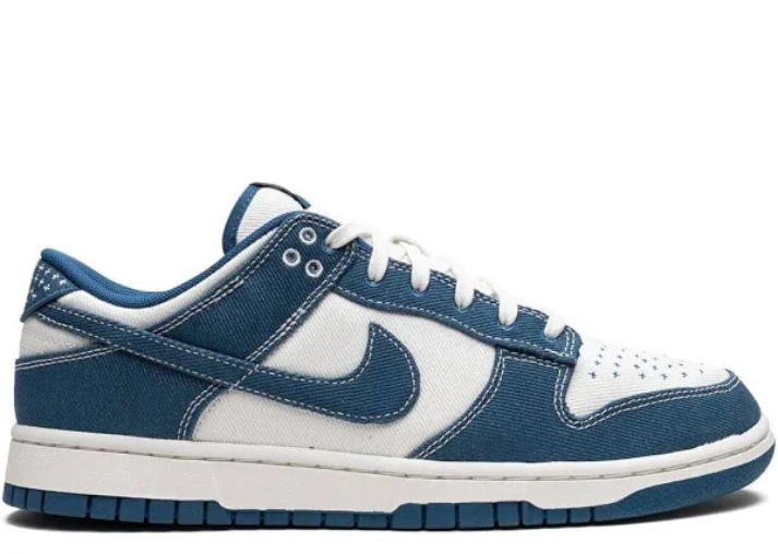 Nike Dunk Low ‘Industrial Blue’ sneaker featuring deep blue denim overlays, white leather base, and classic low-top silhouette for a timeless look.
