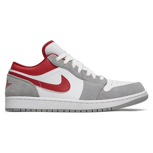 Jordan 1 Low Light Smoke 'Grey Red' sneaker featuring a white leather upper, grey suede overlays, and red accents on the Swoosh and collar.