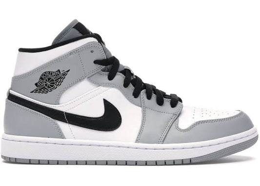 Jordan 1 Mid 'Light Smoke Grey' sneaker in a side profile view, featuring a white, grey, and black colorway with premium leather construction.