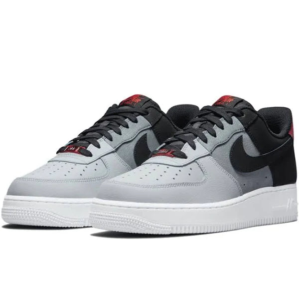 Nike Air Force 1 Low '07 Black Smoke Grey' sneakers in a side-by-side view, showcasing premium materials and a sleek black and grey colorway.