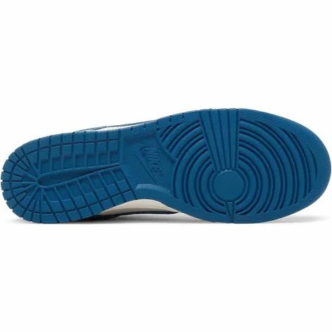 Nike Dunk Low ‘Industrial Blue’ outsole in deep blue rubber, featuring circular traction pattern for superior grip and durability on various surfaces.