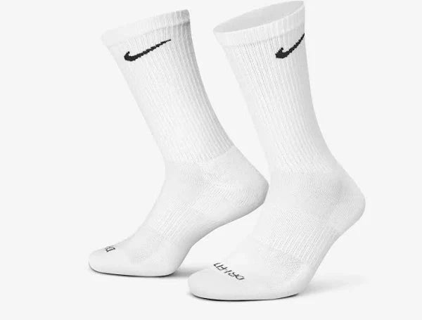 Nike Everyday Socks in white with black swoosh logo. Long, ribbed design ensures comfort and support for daily wear.