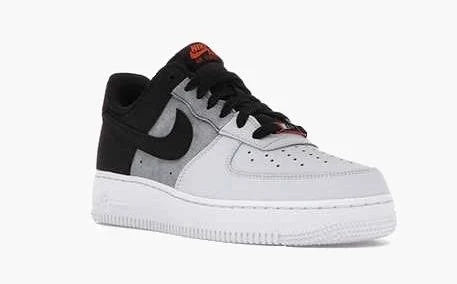 Close-up of the Air Force 1 Low '07 Black Smoke Grey' sneaker, highlighting the gradient design, black Swoosh, and durable construction.