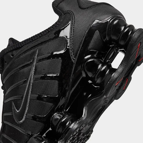 Close-up of Nike Shox TL 'Black Max' heel showcasing glossy black detailing and signature Shox cushioning for enhanced shock absorption.