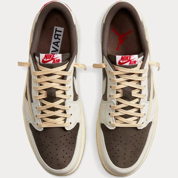 Top-down view of Jordan 1 Retro Low OG 'TRAVIS SCOTT REVERSE MOCHA' highlighting cream laces, brown perforated toe box, and Nike Air branding.