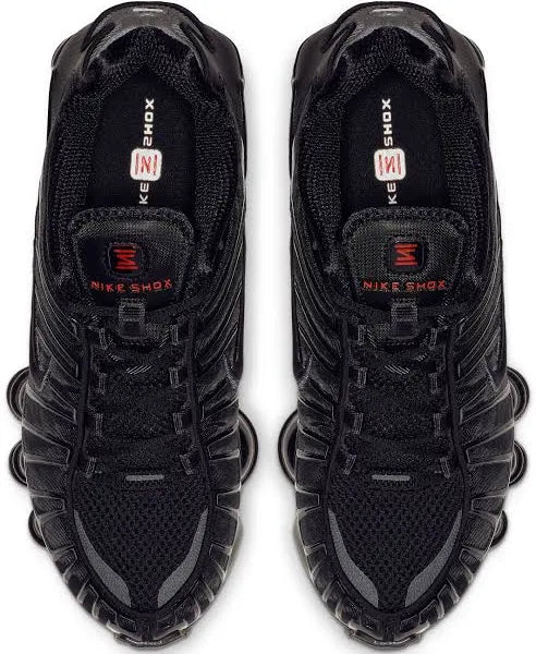 Top view of Nike Shox TL 'Black Max' sneakers displaying breathable mesh upper, black laces, and red Nike Shox branding for a bold look.