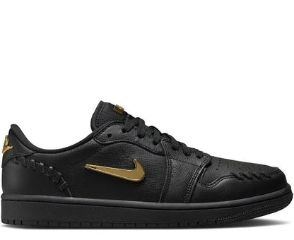 Jordan 1 Low Method of Make Black sneaker featuring premium black leather with gold accents and intricate stitching details.