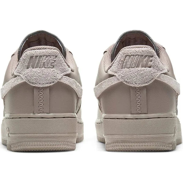 Rear view of Nike Air Force 1 Low LXX 'Malt' highlighting suede heel tab with embossed Nike branding and unique stitched detailing.
