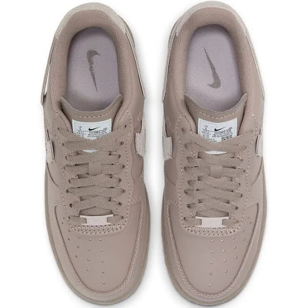 Top view of Nike Air Force 1 Low LXX 'Malt' showcasing perforated toe box, tonal laces, and branded tongue tag for a sleek, modern aesthetic.