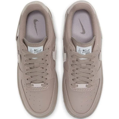 Top view of Nike Air Force 1 Low LXX 'Malt' showcasing perforated toe box, tonal laces, and branded tongue tag for a sleek, modern aesthetic.